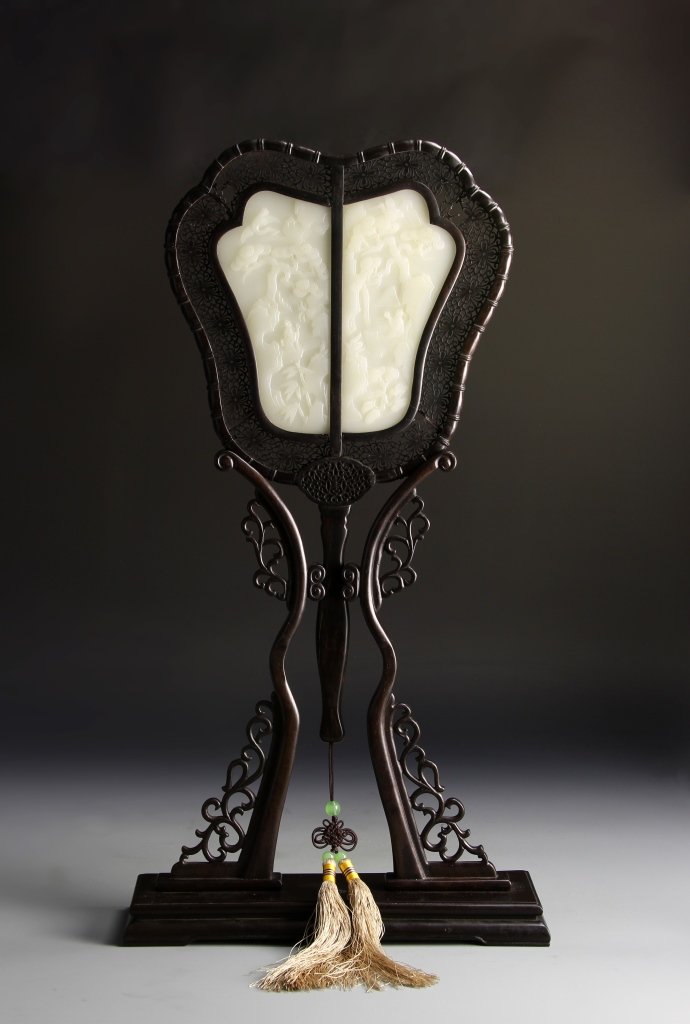 Chinese Hardwood Table Screen: China, 20th C., hardwood table screen with jade inlays, elaborately carved hardwood table screen, finished with a tasseled tie with three green jade beads, framing a white jade inlay, carved with inci
