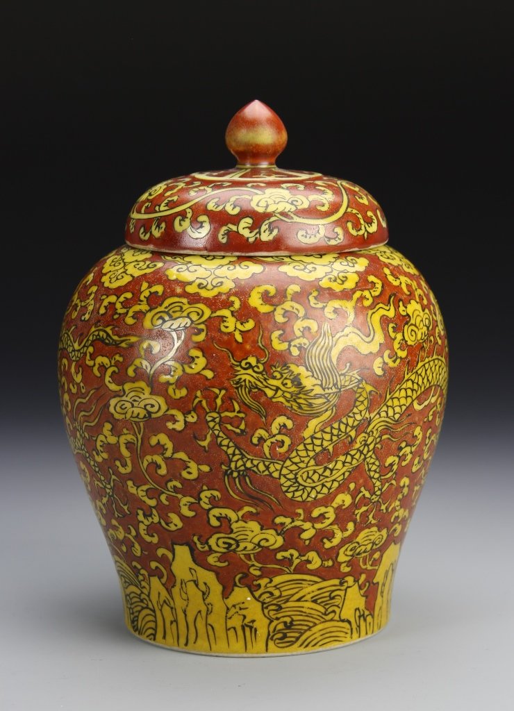 Chinese Yellow and Coral Vase: China, Ming Period, yellow and coral vase, tapering of rounded shoulders to foot, red ground color painted with yellow dragon surrounded by a cloud motif, auspicious symbol on lid, mark on base. Heigh