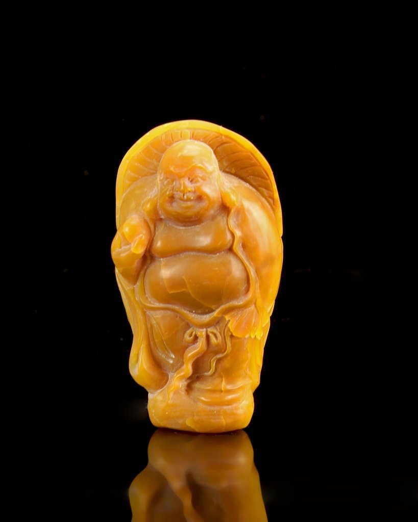 Chinese Shousan Stone Longevity Pendant: China, Shoushan stone longevity pendant, figure in a standing position, wearing a flowing robe, in a deep yellow hue. Height 2 1/4 in.