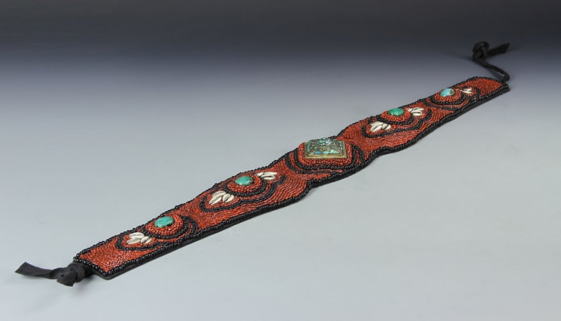 Chinese Tibetan Coral and Seashell Belt: China, Tibet, 19th C., belt made of coral, turquoise and seashells, consisting of numerous small red and black coral tube beads, decorated with four round turquoise stones, framed by seashells on each