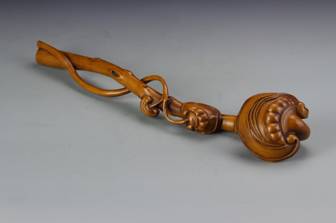 Chinese Carved Boxwood Ruyi Scepter: China, 19th C., carved boxwood Ruyi scepter, the staff in the form of a branch of wood with carved knots and bamboo section, with intricate decorative top. Length 15 3/4 in.