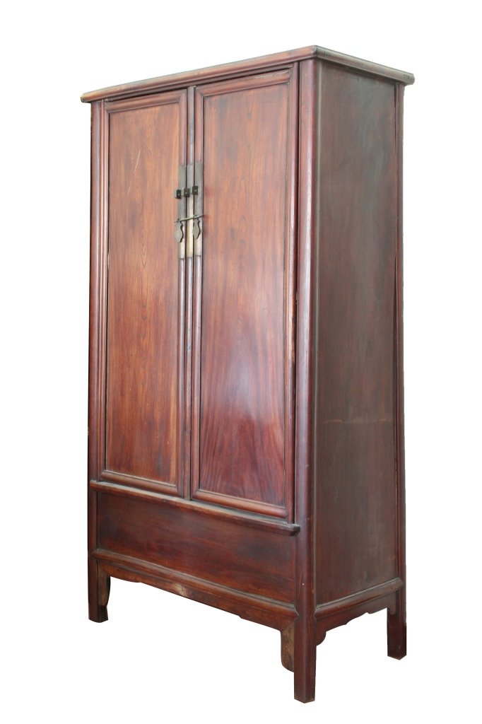 Chinese Rosewood Cabinet: China, 19th C., rosewood cabinet, smoothly carved with simple and clean geometric details, intricate locking mechanism on the front. Height 77 in., Width 43 in., Depth 21 in.
