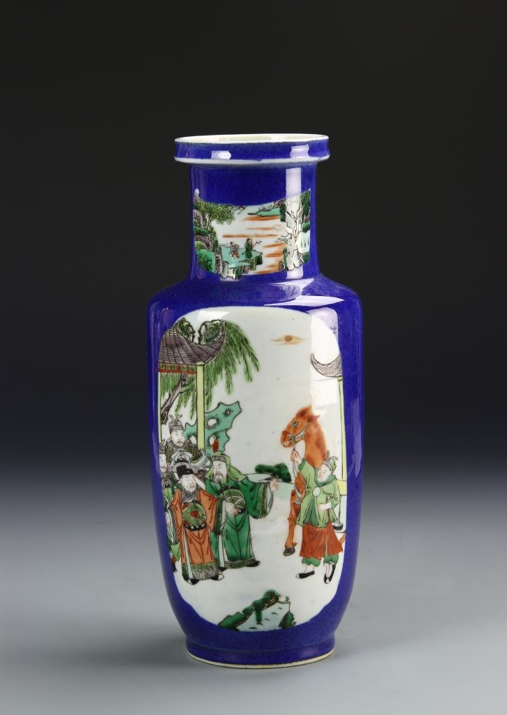 Chinese Wucai Vase: China, 19th C., Wucai vase, cylindrical body with high shoulders and a flared, flat rim, richly hued blue ground with scenes of natural landscapes and figures on horseback, double ring mark. Height 11