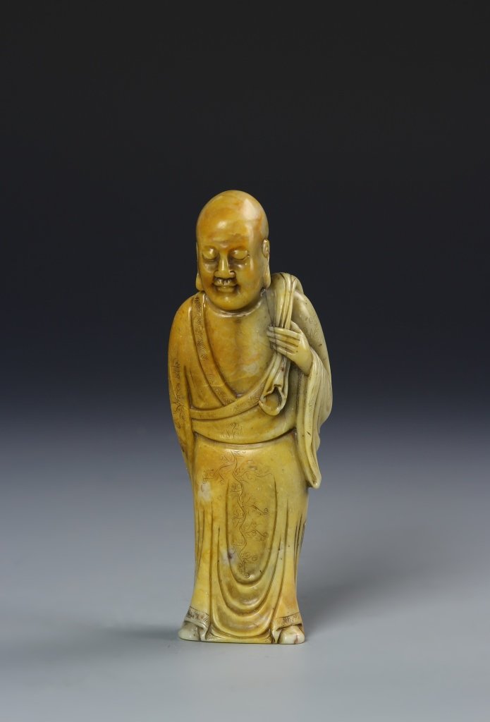 Chinese Soushan Buddha/Louhan Figure: China, 19th C., Qing Dynasty, Soushan Buddha/Louhan figure, in a standing position, carrying sack over shoulder, wearing intricately carved robes incised with motifs of flowers and auspicious symbols
