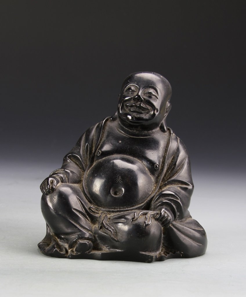 Chinese Hardwood Luohan: China, ROC period, hardwood Luohan, in a seated position, with legs crossed and hands resting on each knee, with robes open to show a round belly, in a deep brown hue. Height 4 3/4 in.