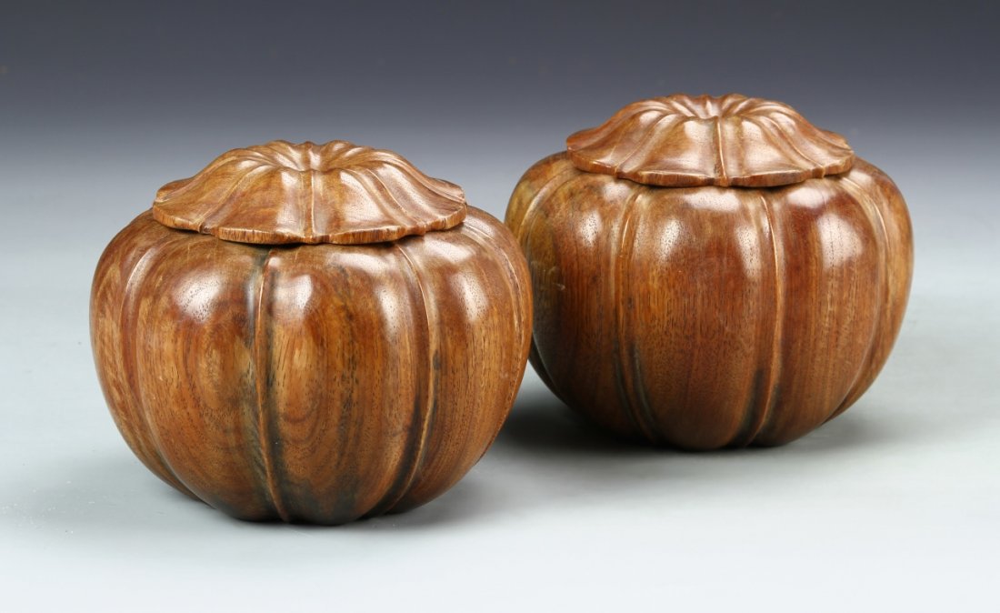 Chinese Huanghuali Chess Boxes: China, a pair of Huanghuali goal chess boxes, each a bulbous form, carved to resemble vegetable forms, with fitted covers, flat base and a high shine surface. Width 4 1/4 in., Height 5 in.