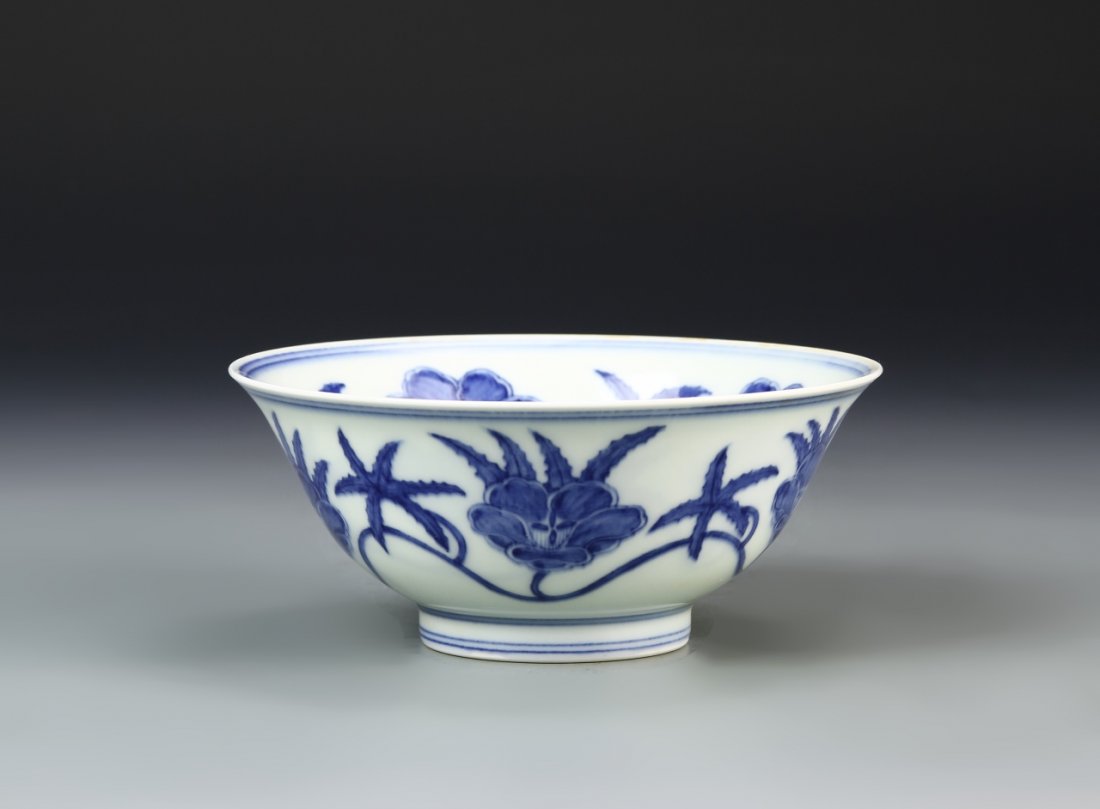 Chinese Blue and White Bowl: China, blue and white bowl, on a raised base, interior and exterior painted with a blue floral motif, over a white ground, double ring mark on rim and base, Ming mark. Diameter 6 in., Height 2 1/2 in.