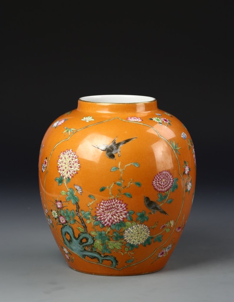 Chinese Famille Rose Jar: China, 19th C., Famille Rose jar, short neck, round shoulders and body, flat base, deep orange ground with flower and bird motifs, Qianlong mark on base. Height 7 1/2 in.