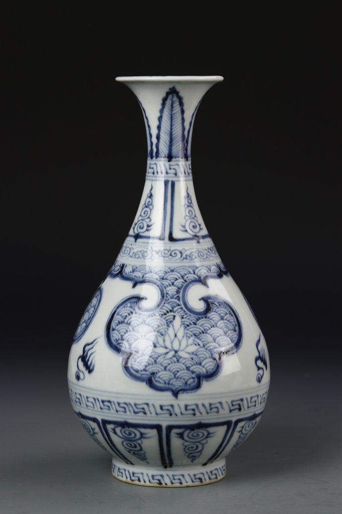 Chinese Blue and White Yuhuchunping Vase: China, blue and White Yuhuchunping vase, flared rim, skinny neck, onion bulb body on footed base, geometric and feathered designs throughout in light blue shades . Height 10 in.