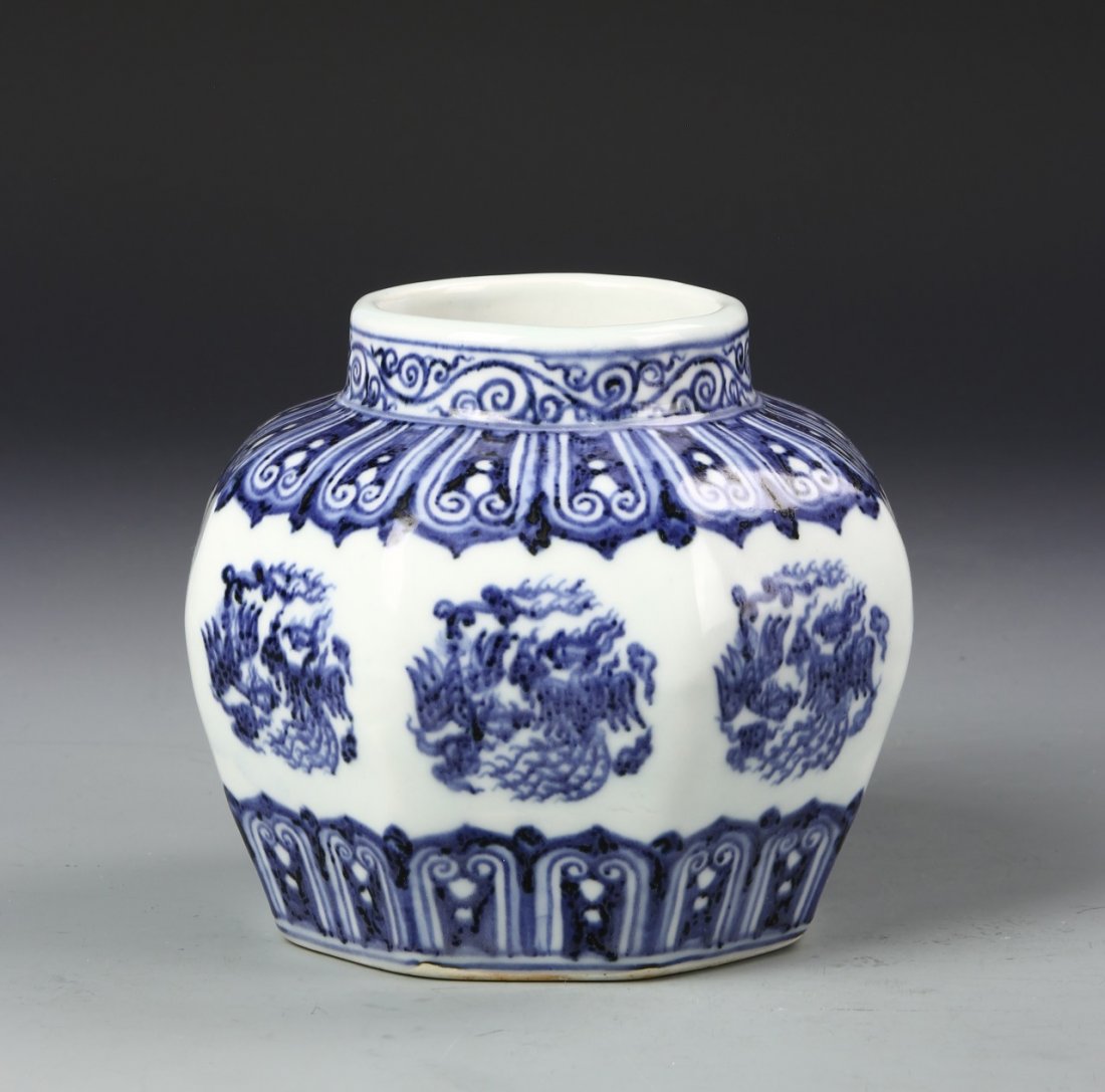 Chinese Blue and White Dragon Jar: China, antique blue and white jar, round body with bulged divisions and flat base, blue decoration of thick, feather borders and dragon emblems, Xue de mark. Height 5 in., Width 4 3/4 in.