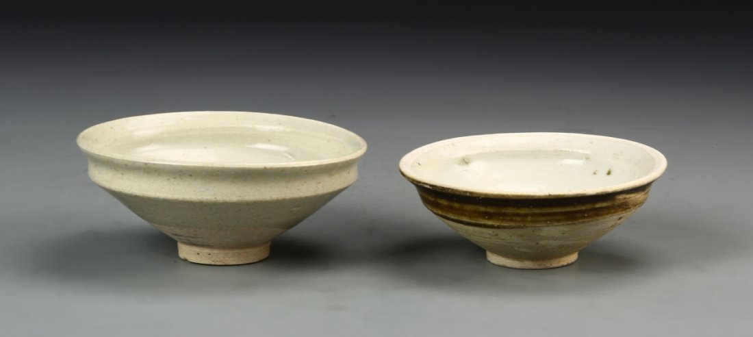 Two Antique Chinese Bowls: China, two antique bowls in white speckled glaze on high footed bases with incised borders. Width 4 1/4 in., Height 1 3/4 in. Provenance: Private collection of Norio Azuma, Manhattan, NY