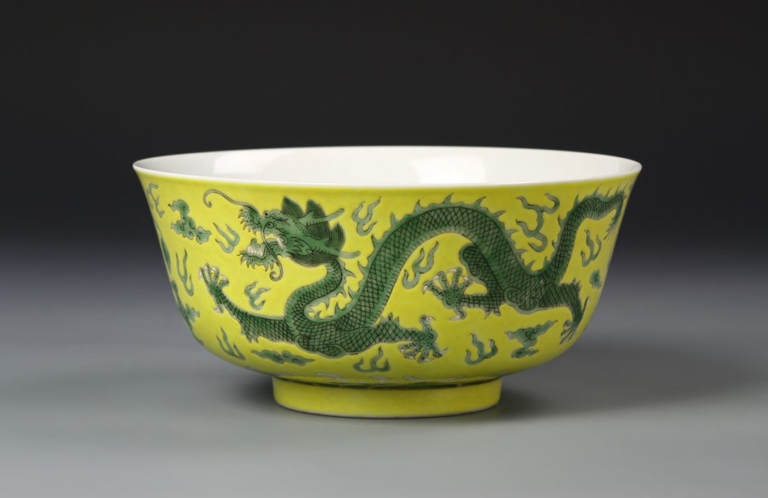 Chinese Famille Rose Bowl: China, 19th C., Famille Rose bowl, deep potted bowl on footed base, yellow decoration on exterior with green dragon motif, plain white interior, six character Guangxu mark on base. Diameter 7 1/8 in.,