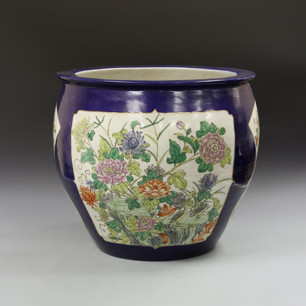 Chinese Famille Rose Fish Tank: China, ROC Period, Famille Rose fish tank, with a high rounded shoulder, flattened rim, deep blue glaze, and panels of brightly colored floral motifs. Height 18 1/4 in., Width 20 1/2 in.