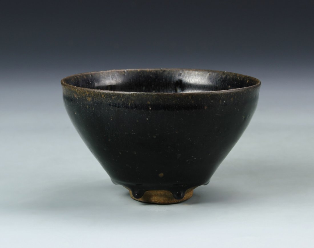 Chinese Antique Jian Yao Bowl: China, antique Jian Yao bowl, brown base color that has been expertly crafted to look as if it has been dipped in a black colored paint. Height 4 7/8 in., Diameter 3 in.
