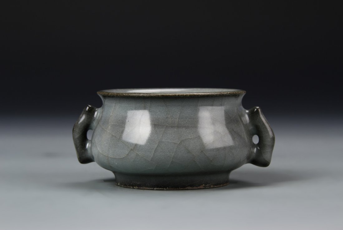 Chinese Lung Quan Yao Censer: China, antique Lung Quan Yao censer, on a slightly raised base, with an arched, rectangular handle on each side, in a grey glaze with a high shine surface. Width 4 in., Height 1 7/8 in.
