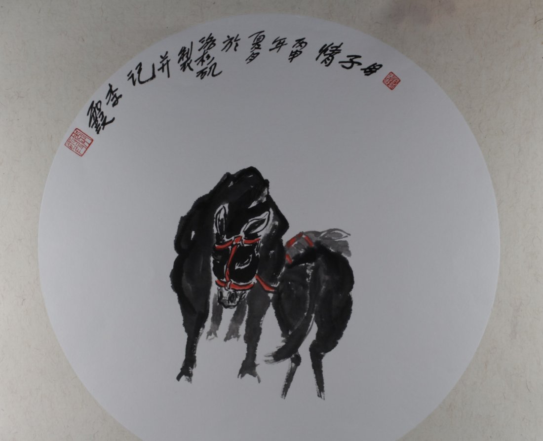 Chinese Painting of Donkeys: China, ink on paper in circular form, depicting a scene of two lack donkeys nuzzling together with calligraphy and red mark at top. Diameter 16 1/4 in.
