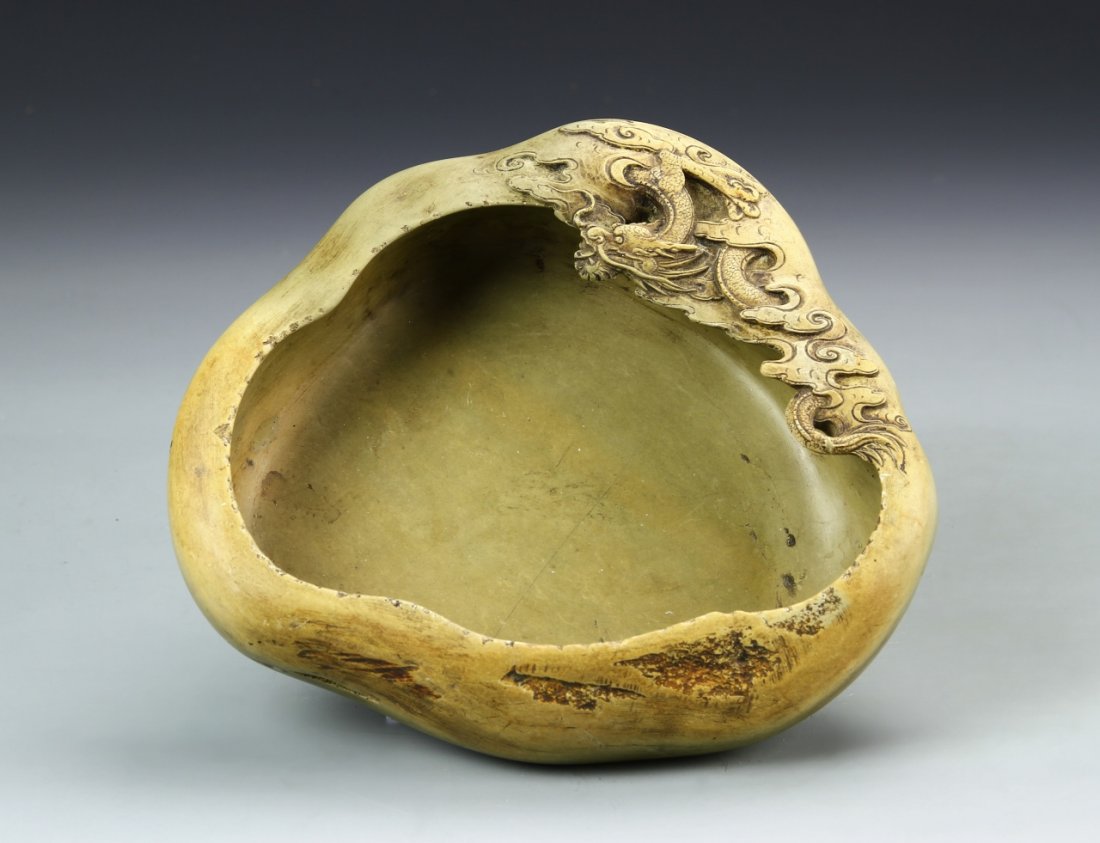 Chinese Green Duan Brush Washer: China 19th C. - ROC Period, green Duan brush washer, carved into an abstract shape with some textural details and a carved dragon at the top, smooth plain interior. Length 8 1/4 in., Height 2 /4 in.