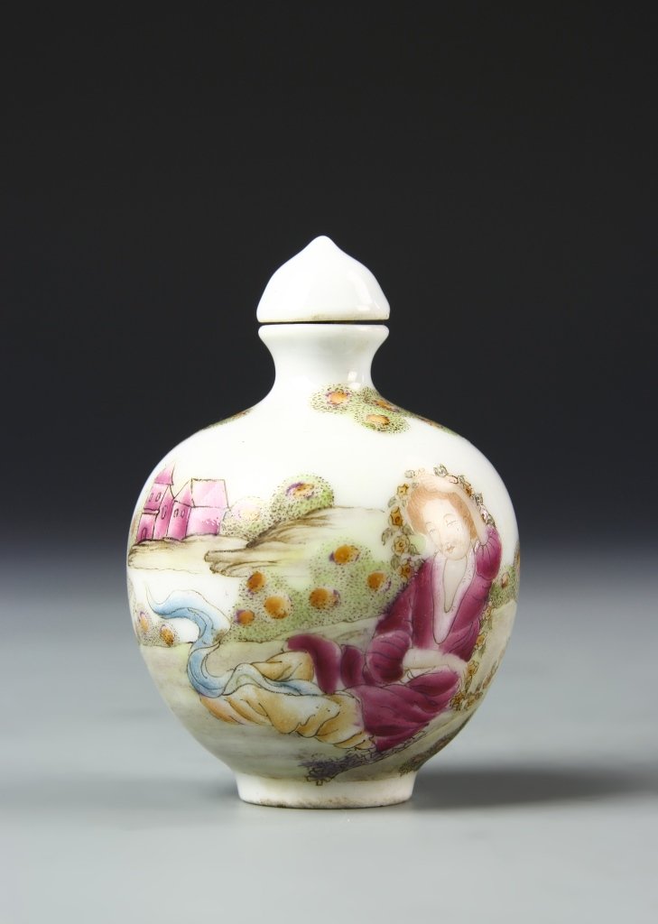Chinese Famille Rose Snuff Bottle: China, Famille Rose snuff bottle, decorated with a scene of a figure in dark purple robes, sitting in a garden landscape against white ground with Qianlong mark. Height 2 3/4 in