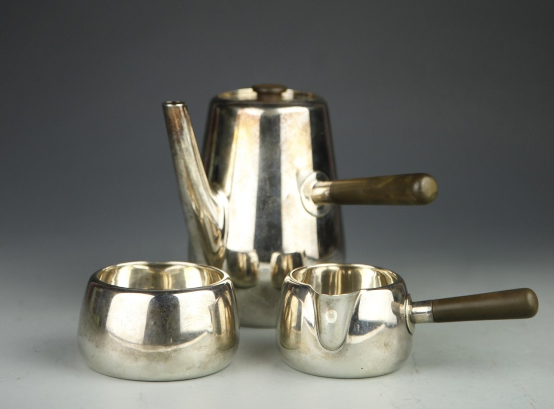 Set of European Silver Tea Set: 19th C., Set of European Silver Tea Set, consisting of tall coffee pot with milk jug and sugar bowl, both pot and jug have elegant handles, signed Mark Ostcher. Biggest Height 5 in.
