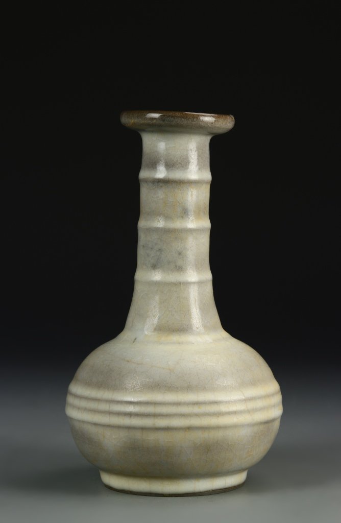 Chinese Antique Lung Quan Yao Vase: China, Song dynasty, Lung Quan Yao vase, darker and rounded lip at mouth, ribbed bands around neck and round body, ice crackles crisscross throughout against dark beige glaze. Height 9 1/2 in. Provena