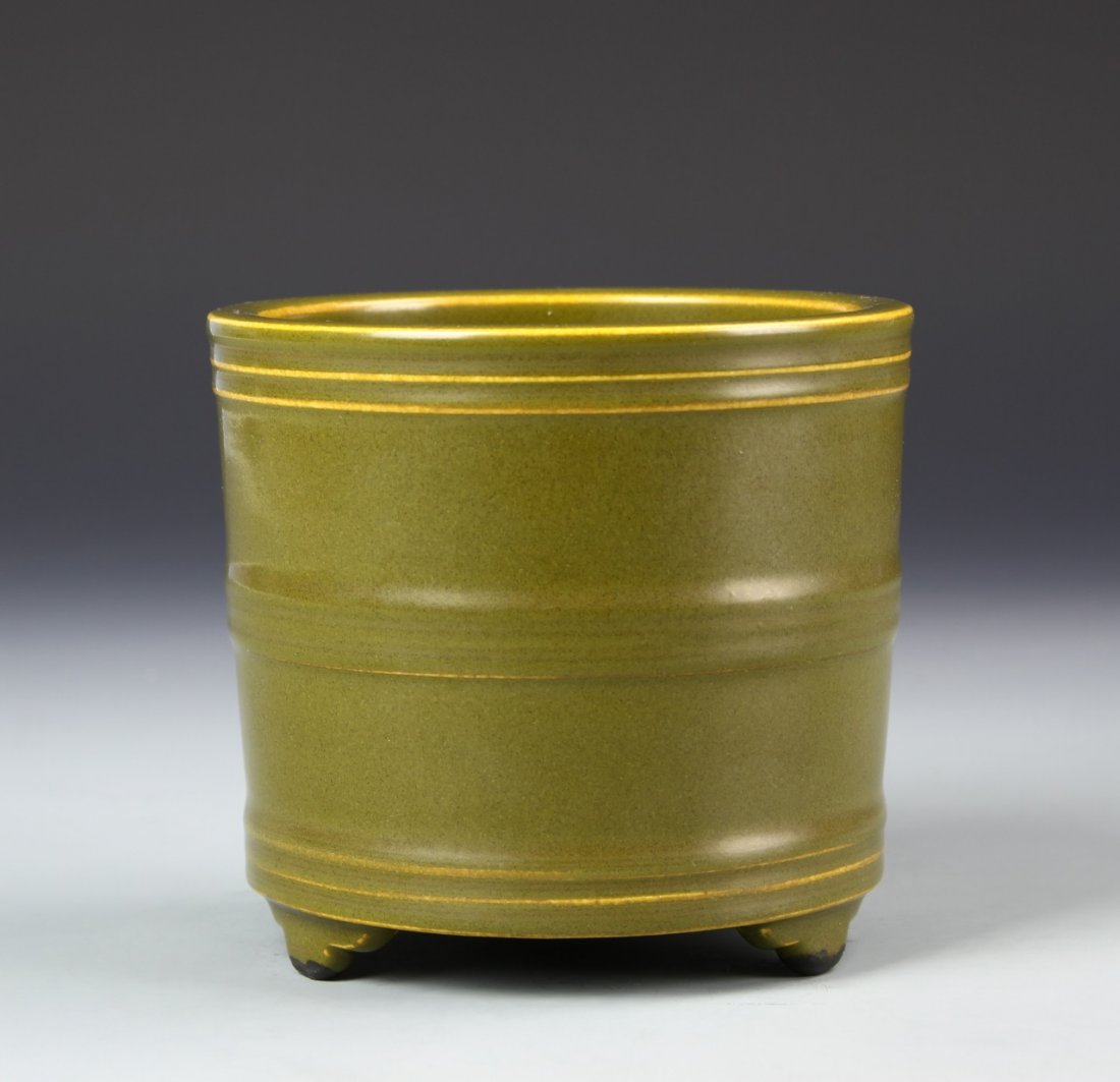 Chinese Tea Dust Tripod Censer: China, 19th C., tea dust tripod censer, round body divided by three line borders around exterior sides, olive green coloring throughout with Qianlong mark on base. Height 4 1/2 in.