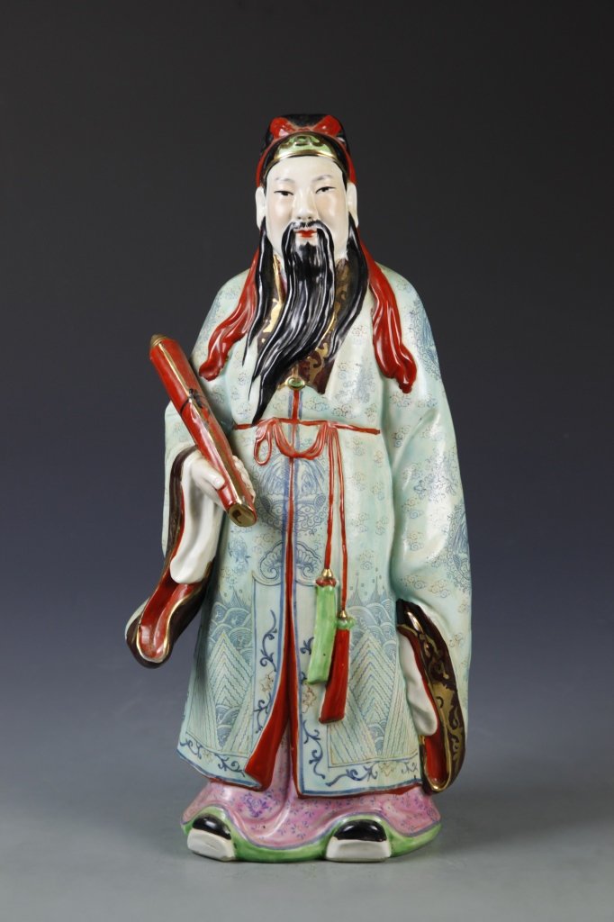 Chinese Famille Rose Wiseman Figure: China, Famille Rose, carved statue of wise man with a long black beard, wearing loose colorful robes, standing and holding a rolled up scroll, mark on base. Height 16 in.