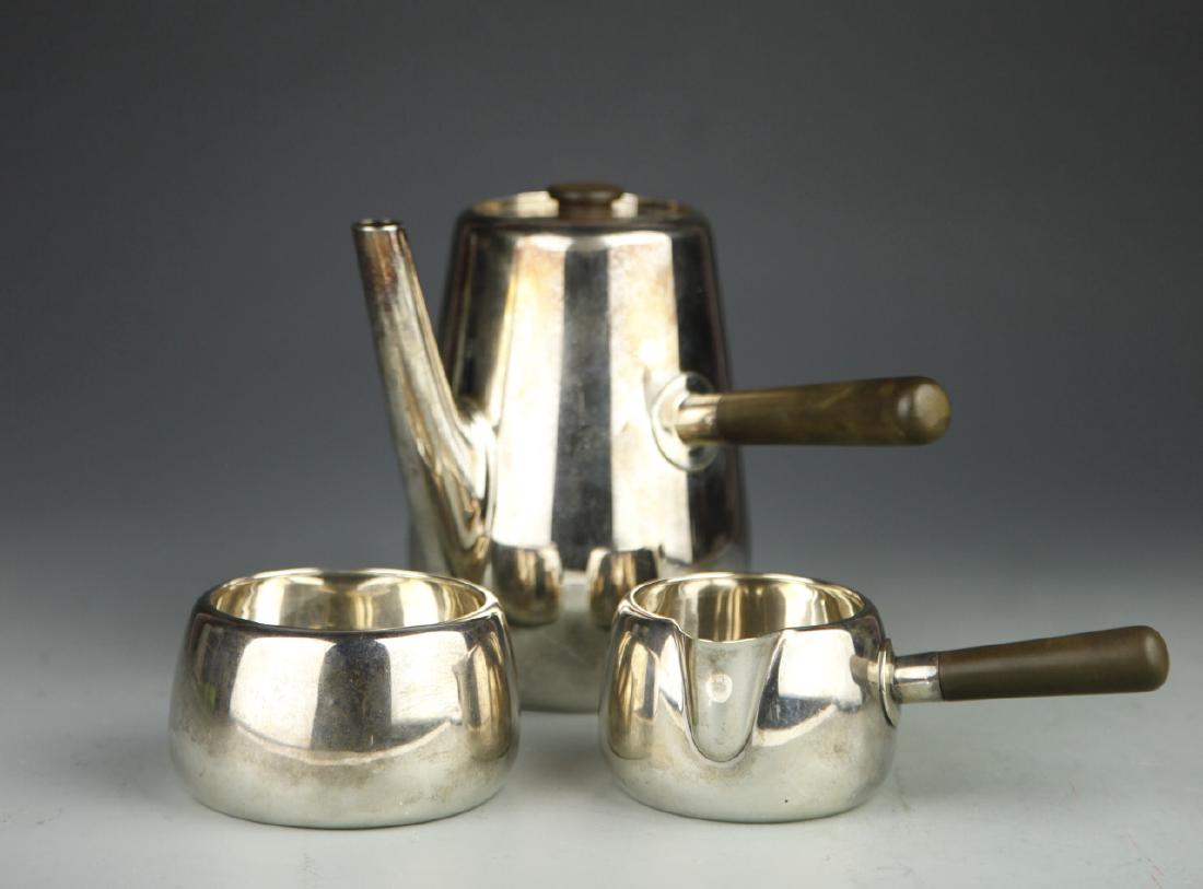 Set of European Silver Tea Set: 19th C., Set of European Silver Tea Set, consisting of tall coffee pot with milk jug and sugar bowl, both pot and jug have elegant handles, signed Mark Ostcher. Biggest Height 5 in.