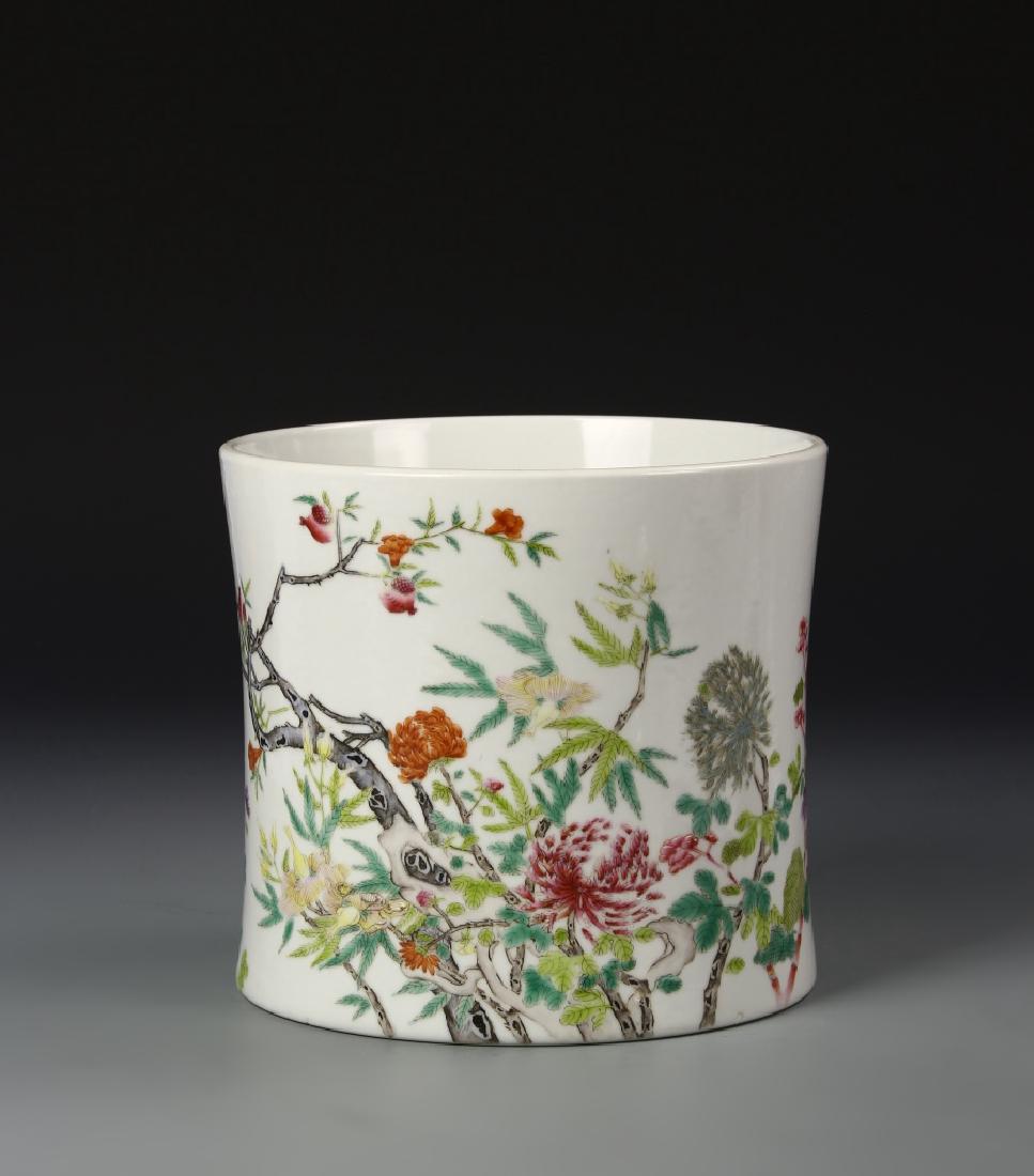 Chinese Famille Rose Brush Pot: China, Qing dynasty, Famille Rose brush pot decorated on one side to show pink and orange flowers blooming within vines and leaves. Height 6 1/4 in., Width 7 in.