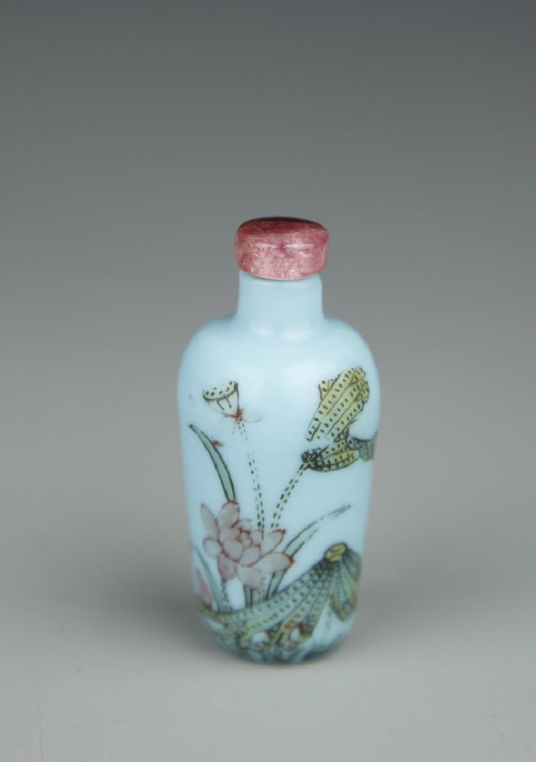 Rare Chinese Peking Glass Snuff Bottle: China, 19th C., rare Peking glass snuff bottle, baluster formed body with painted flowers, with tourmaline stopper, Guyuexuan mark. Height 2 1/4 in.