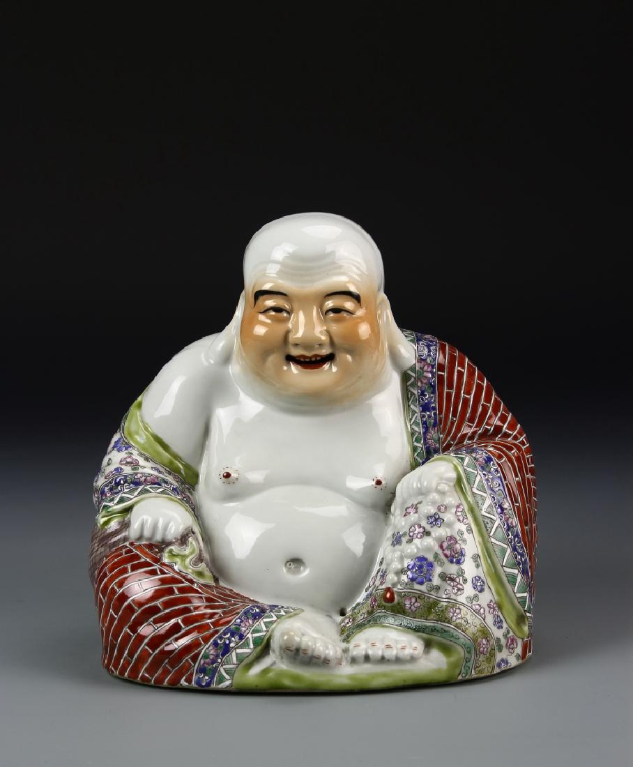 Chinese Famille Rose Buddha: China, ROC, Famille Rose Buddha, in a seated pose, with richly painted robes, round belly and smiling expression, flat base. Height 9 in.