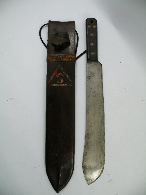 A World War II East Kent Signals Regiment machete,: A World War II East Kent Signals Regiment machete, blade marked JJB 1945 and broad arrow in leather scabbard.