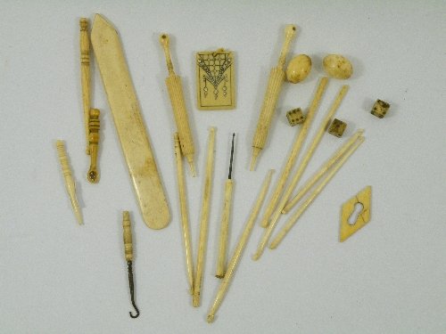 A mixed lot of 19th Century ivory, bone and ivorin: A mixed lot of 19th Century ivory, bone and ivorine items: Two umbrella shaped needle cases with Crystal Palace Stanhope in handle, early 19th C snuff spoon, Georgian escutcheon, turned crochet hooks