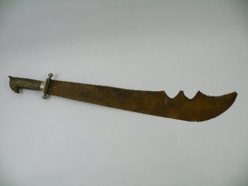 Unusual Eastern machete or bladed weapon with part: Unusual Eastern machete or bladed weapon with part punched decoration to handle a serrated blade, horn handle carved in the form of an exotic bird, 73cm , early 20th C
