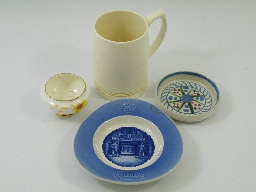 A Wedgwood white matt glaze tankard by Keith Murra: A Wedgwood white matt glaze tankard by Keith Murray, a Royal Copenhagen Carlsberg dish, a Buckman, Portobello Pottery hand painted pin dish, and a small Royal Doulton Marguerite" posy bowl (4)."