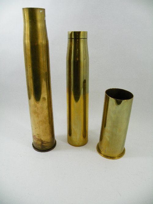 A large, brass shell case, marks to the base R.L.: A large, brass shell case, marks to the base R.L. - I - T - 1902. & A World War II brass shell case marked 1943" to base"