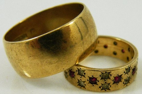 A 9ct yellow gold, wide wedding band size S and a : A 9ct yellow gold, wide wedding band size S and a 9ct yellow gold ring set with rubies alternating with spinels, size J. Total weight 11grm.