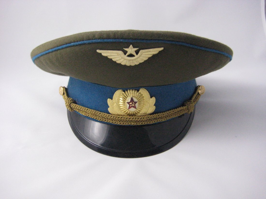 Soviet Russian Army Officer Dress Peaked Cap: You are bidding on a Soviet Army officer's dress peaked cap. Red piped black band and O.D. crown. Gilt oak leaves/large rosette with a red Star insignia. Gold bullion chincord. Satin type lining. Than