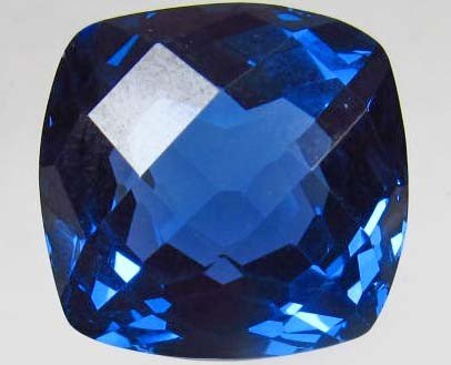 Cushion Cut London Blue Topaz Gemstone: 34.3 CTS: You are bidding on a Cushion Cut London Blue Topaz Gemstone: 34.3 CTS. This is a beautiful stone - Please refer to the picture. Thank you for your business and support!