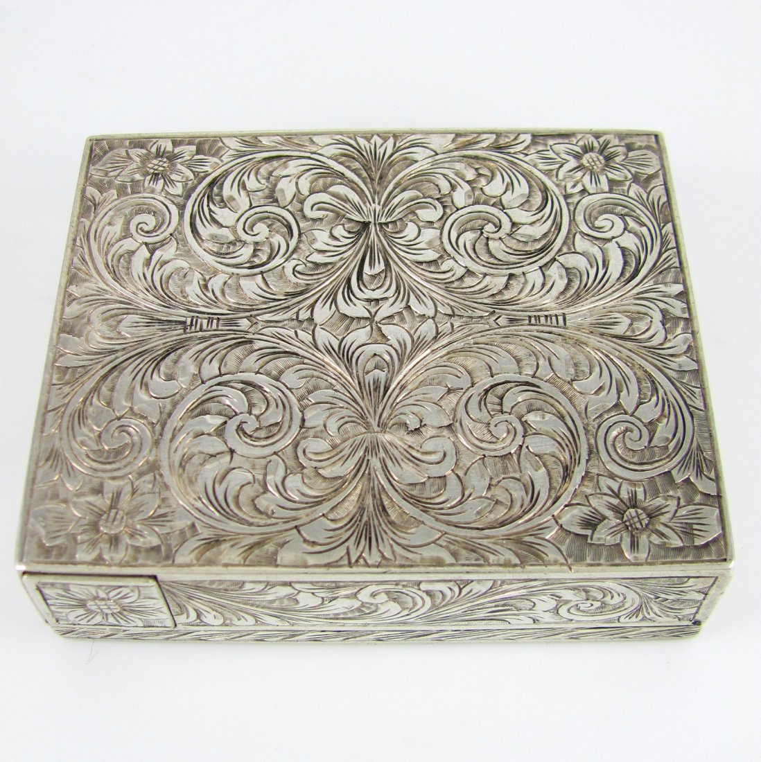 Italian Silver Hand Chased Brite Cut Compact Box: You are bidding on a vintage 1930's Italian silver hand chased brite cut symmetrical floral designed compact box with lipstick holder. It is in excellent condition and measures 2-7/8" long, 2-3/8" wid