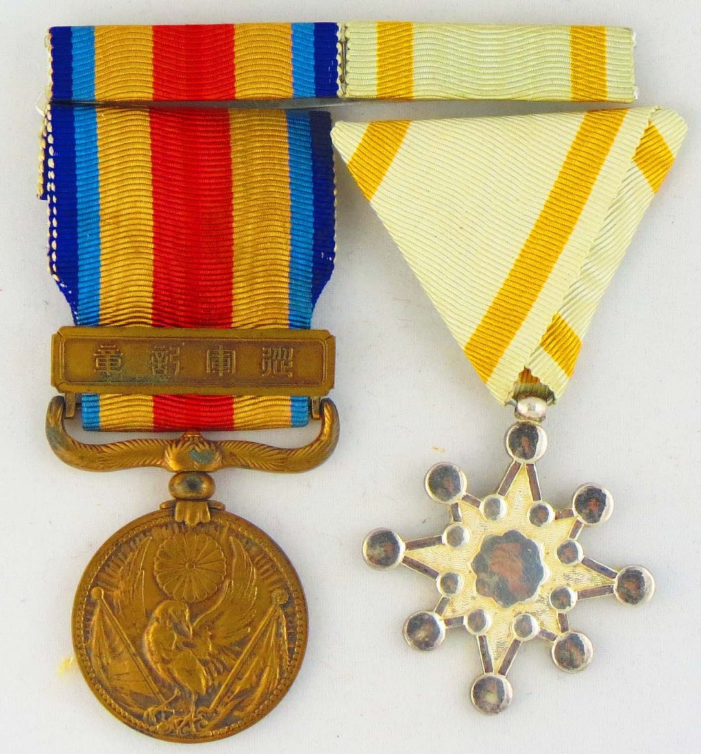 WWII Japanese 2 Ribbon Bar Rising Sun and China In: You are bidding on a set of 2 mounted WW2 original silk ribbons on a 2 ribbon bar including the China Incident and Rising Sun 8th class medals.