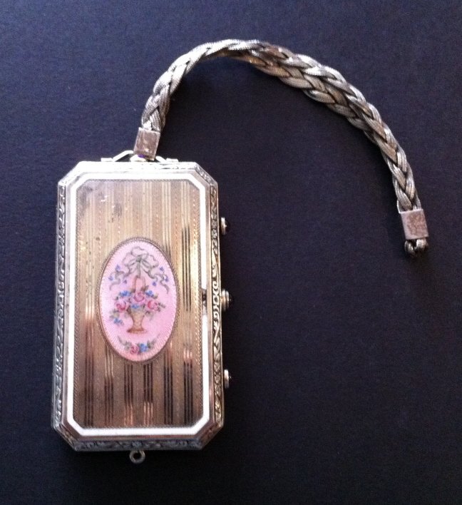 Foster and Bailey sterling silver compact: Hand-painted flowers and amethyst stones, 3.7 troy ounces of beautiful craftsmanship. An all-over feel good piece. If you collect compacts this one will make your collection stand out! Take the zoom t