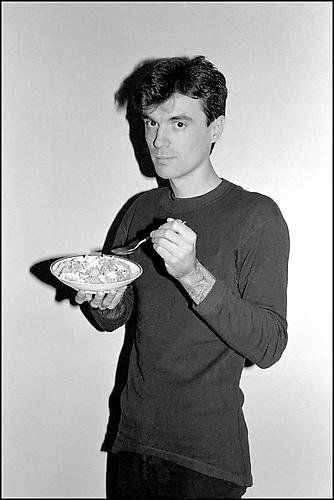 Bobby Grossman, "David Byrne, Corn Flakes, Long Island : Artist Name: Bobby Grossman Title: David Byrne, Corn Flakes, Long Island City Loft Year: 1979 Edition: Edition Of 50 Medium: Silver Gelatin Print Dimensions: 24h x 20w x 0d in Signed: