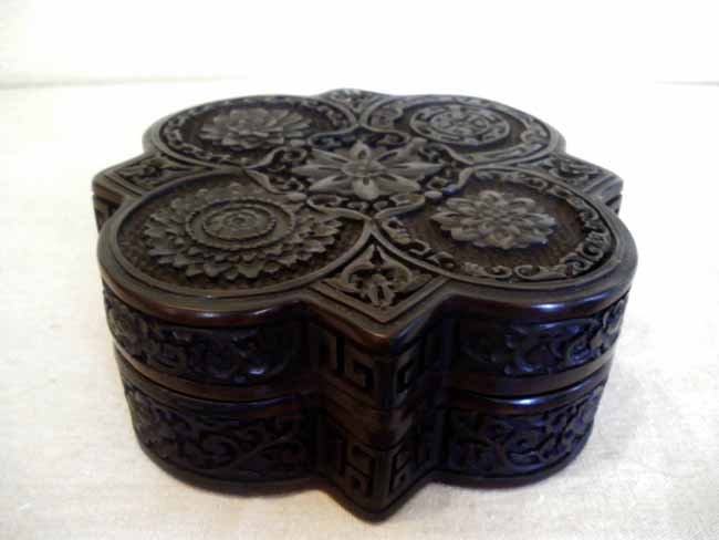 Asian Carved Black Cinnabar Box, Signed: An equisitely carved black cinnabar box, signed undneath lid, measuring 6" x 2 ½".