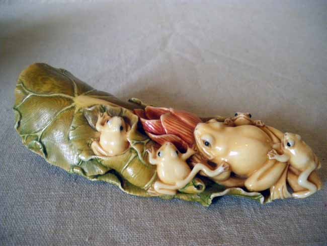 Chinese Carved Ivory Figural Netsuke Frogs & Lily : An absolutely beautiful Chinese carved ivory netsuke composed of five frogs atop a lily pad, exquisitely colored & well detailed, signed, measuring 5" length.