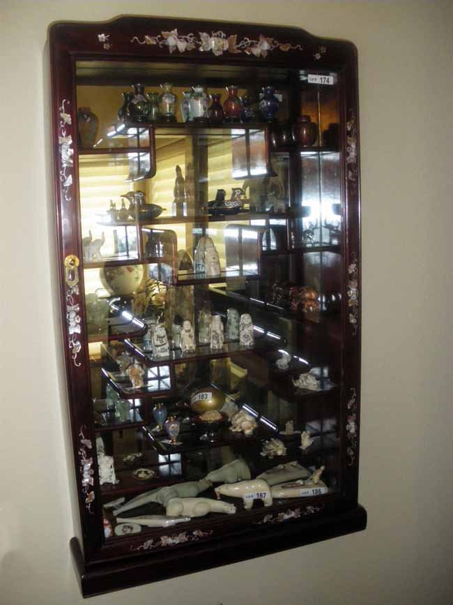 Rosewood Mother of Pearl Inlaid Wall Mount Display: A handsome rosewood & mother of pearl inlaid wall mount display case, circa 1950, measuring 33" tall x 19 ¼" wide x 4 ¼" deep. (contents pictured are not included with cabinet)