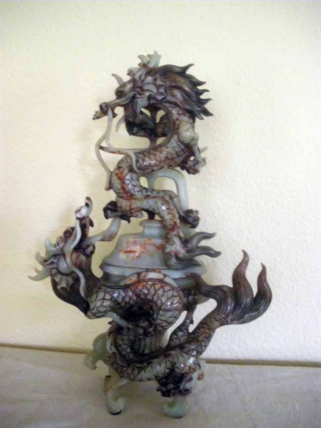 Chinese Carved Soapstone Warring Dragons Censor: An intricately carved soapstone Chinese figuragl warring dragons censor, measuring 12 ½" tall.