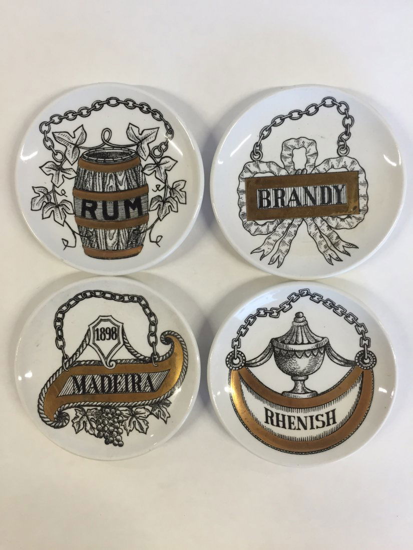 Fornasetti Set of 4 Small Plates w/ Liquor Names: Fornasetti Set of 4 Small Plates w/ Liquor Names. Signed.