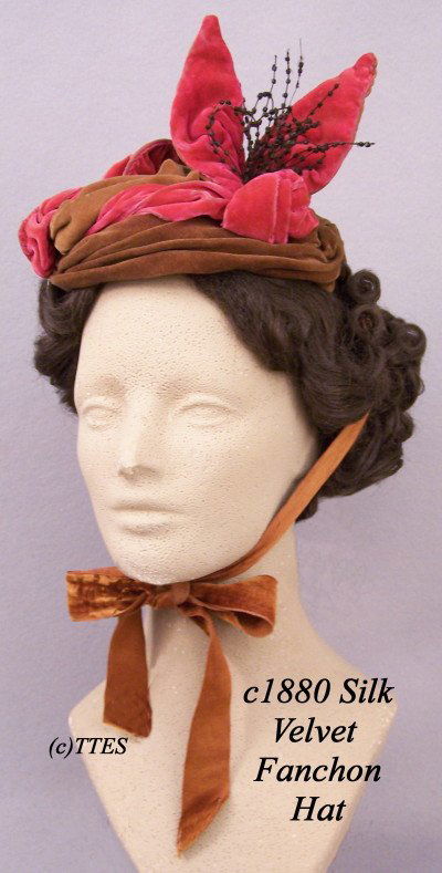Colorful c1880 Lady's Silk Velvet Fanchon Hat: A golden brown and pink silk velvet with a beaded cockade, wired frame, long ties and a black polished cotton tipping that reads "Temple of Design, M. A. Baird … Lowell, MA.." LA1-91.