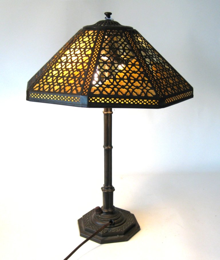 Tiffany Studios New York bronze and stained glass table: Tiffany Studios New York bronze and stained glass table lamp, 17 inches tall. Condition: almost all the stained glass either missing or broken.