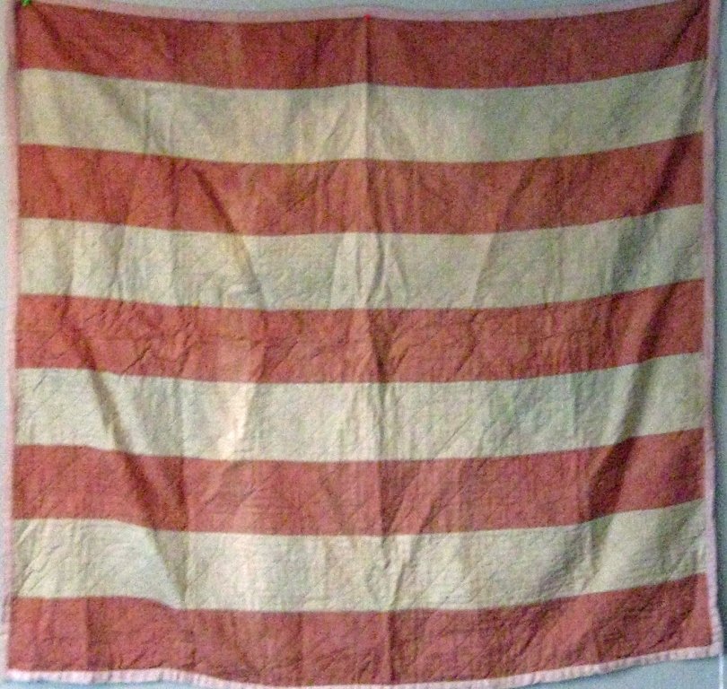 Bar pattern crib quilt, 45 by 48 inches. Condition:: Bar pattern crib quilt, 45 by 48 inches. Condition: good.